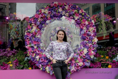 Visitors pose with the multitude of flowers both inside and outside the Macy's Department Store during the annual Macy's Flower Show on 34th Street and Broadway in New York City on March 27, 2022. (Photo by Andrew Schwartz)