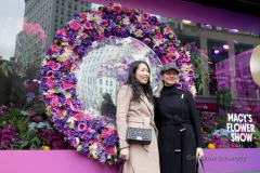 Visitors pose with the multitude of flowers both inside and outside the Macy's Department Store during the annual Macy's Flower Show on 34th Street and Broadway in New York City on March 27, 2022. (Photo by Andrew Schwartz)