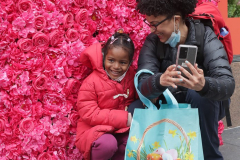 Visitors pose with the multitude of flowers both inside and outside the Macy's Department Store during the annual Macy's Flower Show on 34th Street and Broadway in New York City on March 27, 2022. (Photo by Andrew Schwartz)
