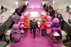 Visitors walk past the multitude of flowers inside the Macy's Department Store during the annual Macy's Flower Show on 34th Street and Broadway in New York City on March 27, 2022. (Photo by Andrew Schwartz)