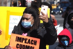 Protesters gather at Washington Square Park to demand the resignation of New York Governor Andrew Cuomo on March 20, 2021 in New York City. The demands for Governor Cuomo's resignation are in response to the sexual harassment allegations made by numerous women and a cover-up preventable of coronavirus (COVID-19) deaths in nursing homes.