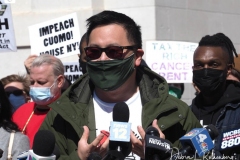 New York Assemblyman Ron Kim and dozens of protesters gather at Washington Square Park to demand the resignation of New York Governor Andrew Cuomo on March 20, 2021 in New York City. The demands for Governor Cuomo to resign are in response to the sexual harassment allegations made by numerous women and a cover-up preventable of coronavirus (COVID-19) deaths in nursing homes.