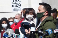 New York Assemblyman Ron Kim (and his daughter) along with dozens of protesters gather at Washington Square Park to demand the resignation of New York Governor Andrew Cuomo on March 20, 2021 in New York City. The demands for Governor Cuomo's resignation are in response to the sexual harassment allegations made by numerous women and a cover-up preventable of coronavirus (COVID-19) deaths in nursing homes