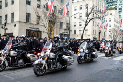 Police Officer Wilbert Mora was laid to rest 2/2/22 after being posthumously promoted to Detective First Grade, and eulogized at St. PatrickÕs Cathedral. Thousands of police from all parts of the country lined Fifth Ave. as the procession carrying Detective Mora passed.  Mora was gunned down along with his partner Jason Rivera, who passed away a few days earlier.