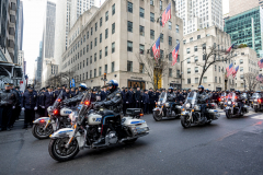 Police Officer Wilbert Mora was laid to rest 2/2/22 after being posthumously promoted to Detective First Grade, and eulogized at St. Patrick’s Cathedral. Thousands of police from all parts of the country lined Fifth Ave. as the procession carrying Detective Mora passed.  Mora was gunned down along with his partner Jason Rivera, who passed away a few days earlier.