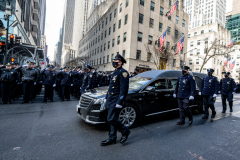 Police Officer Wilbert Mora was laid to rest 2/2/22 after being posthumously promoted to Detective First Grade, and eulogized at St. PatrickÕs Cathedral. Thousands of police from all parts of the country lined Fifth Ave. as the procession carrying Detective Mora passed.  Mora was gunned down along with his partner Jason Rivera, who passed away a few days earlier. The funeral procession heads down Fifth Ave.