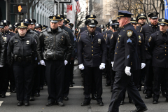 Police Officer Wilbert Mora was laid to rest 2/2/22 after being posthumously promoted to Detective First Grade, and eulogized at St. PatrickÕs Cathedral. Thousands of police from all parts of the country lined Fifth Ave. as the procession carrying Detective Mora passed.  Mora was gunned down along with his partner Jason Rivera, who passed away a few days earlier.