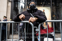 A woman prays the rosary during the funeral service of NYPD Officer Wilbert Mora at St. Patrick’s Cathedral in New York, New York, on Feb. 2,  2022.  (Photo by Gabriele Holtermann/Sipa USA)
