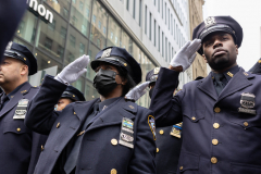 Police officers gather outside ot St. Particks Cathedral to honor Police officer, Wilbert Mora, who was fatally shot during a call of a domestic dispute in Harlem on January 21, 2022, Feb. 2, 2022.
