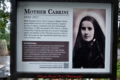 Mother Cabrini Statue at Battery Park South Cove location NYC. A rainy and foggy day. I even photographed a water spout on the Hudson River. It lasted less than a minute then disappeared.