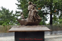 Mother Cabrini Statue at Battery Park South Cove location NYC. A rainy and foggy day. I even photographed a water spout on the Hudson River. It lasted less than a minute then disappeared.