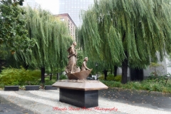 Mother Cabrini Statue at Battery Park South Cove location NYC. A rainy and foggy day. I even photographed a water spout on the Hudson River. It lasted less than a minute then disappeared.