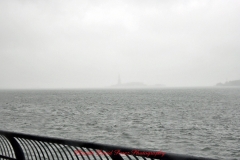 Mother Cabrini Statue at Battery Park South Cove location NYC. A rainy and foggy day. I even photographed a water spout on the Hudson River. It lasted less than a minute then disappeared.