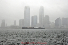 Mother Cabrini Statue at Battery Park South Cove location NYC. A rainy and foggy day. I even photographed a water spout on the Hudson River. It lasted less than a minute then disappeared.