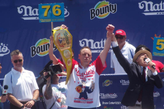 NATHAN’S FAMOUS FOURTH OF JULY HOT DOG-EATING CONTEST
 AT CONEY ISLAND’S MAIMONIDES PARK

World champion Joey Chestnut will defend his title against the world’s top eaters before a live audience at the Nathan’s Famous Fourth of July International Hot Dog-Eating Contest in Coney Island’s Maimonides Park (formerly MCU Park). 

The world’s best eating athletes  go head-to-head in the 10-minute, all-you-can-eat contest. Chestnut’s  broke his world record of 75 hot dogs and buns with 76 hot dogs. against number-two-ranked Geoffrey Esper(who has beaten Chestnut in recent events) .

In the women’s competition, Michelle Lesco won with 30 3/4hot dogs and buns  competed against world pepperoni roll-eating champion Larell Marie Mele and Sarah Rodriguez.