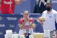 Competitive eater Michelle Lesco competes in the Nathan’s Fourth of July Hot Dog Eating Contest in Coney Island Brooklyn NY on July 4, 2021. Lesco would go on to win contest for the first time by eating 30.75 dogs and buns in 10 minutes. (Photo by Andrew Schwartz)
