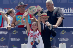 Competitive eater Michelle Lesco celebrates winning the Nathan’s Fourth of July Hot Dog Eating Contest in Coney Island Brooklyn NY on July 4, 2021. Lesco would go on to win contest for the first time by eating 30.75 dogs and buns in 10 minutes.  (Photo by Andrew Schwartz)