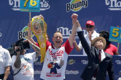 Competitive eater Joey Chestnut celebrates winning the Nathan’s Fourth of July Hot Dog Eating Contest in Coney Island Brooklyn NY on July 4, 2021. Chestnut would go on to win contest by eating 76 dogs and buns.  (Photo by Andrew Schwartz)