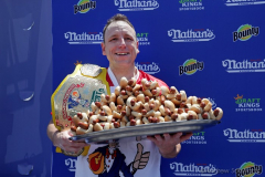 Competitive eater Joey Chestnut holds 76 hot dogs after winning the Nathan’s Fourth of July Hot Dog Eating Contest in Coney Island Brooklyn NY on July 4, 2021.  (Photo by Andrew Schwartz)
