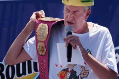 New York City Mayor Bill de Blasio holds up a champions belt during the 2021 Nathans Famous Fourth of July International Hot Dog Eating Contest .