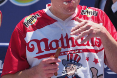 Defending Champion Joey Chestnut competes during the 2021 Nathans Famous Fourth of July International Hot Dog Eating Contest at Coney Island on 04 July 2021 in New York City. 
He broke his record by eating 76 hot dogs and buns in 10 minutes.
