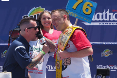 Defending Champion Joey Chestnut competes during the 2021 Nathans Famous Fourth of July International Hot Dog Eating Contest at Coney Island on 04 July 2021 in New York City. 
He broke his record by eating 76 hot dogs and buns in 10 minutes.