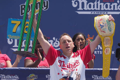 Defending Champion Joey Chestnut competes during the 2021 Nathans Famous Fourth of July International Hot Dog Eating Contest at Coney Island on 04 July 2021 in New York City. 
He broke his record by eating 76 hot dogs and buns in 10 minutes.