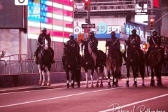 Mounted police from the New York City Police Department  in a mostly empty Times Square in New York City that remains empty due to Covid-19 restrictions.