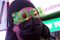Celebrating the New Year in an almost empty Time Square as the Waterford Crystal Ball falls to ring in the New Year.