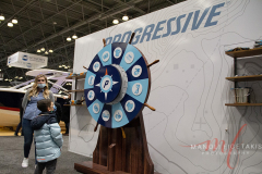 This little boy spinning the wheel at Progressive giveaway both at the New York Boat Show hosted at Javits Center from 26-30 Jan 2022.