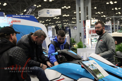 These men are checking out this jet ski at the New York Boat Show hosted at Javits Center from 26-30 Jan 2022.