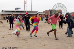 Coney Island New York: January 1 , 2021. In years past, the Coney Island Polar Bear Club would hold their annual New Year's Plunge; however, due to the Coronavirus this year, the event was canceled. In spite of this, New Year's revelers decided to hold their own non-sanctioned plunge at the beach.
