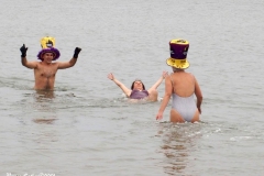 Coney Island New York: January 1 , 2021. In years past, the Coney Island Polar Bear Club would hold their annual New Year's Plunge; however, due to the Coronavirus this year, the event was canceled. In spite of this, New Year's revelers decided to hold their own non-sanctioned plunge at the beach.