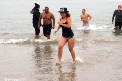 Coney Island New York: January 1 , 2021. In years past, the Coney Island Polar Bear Club would hold their annual New Year's Plunge; however, due to the Coronavirus this year, the event was canceled. In spite of this, New Year's revelers decided to hold their own non-sanctioned plunge at the beach.