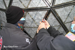 December 27, 2021  New York , Workers Install 192 New Waterford Crystals
On Times Squares New Year’s Eve Ball.The Waterford Crystal New Year’s Eve Ball is a geodesic sphere, 12 feet in diameter, and weighs 11,875 pounds. The Ball is covered with a total of 2,688 Waterford Crystal triangles that vary in size, and range in length from 4 3/4 inches to 5 3/4 inches per side. For Times Square 2022,