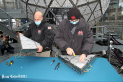 December 27, 2021  New York , Workers Install 192 New Waterford Crystals
On Times Squares New Year’s Eve Ball.The Waterford Crystal New Year’s Eve Ball is a geodesic sphere, 12 feet in diameter, and weighs 11,875 pounds. The Ball is covered with a total of 2,688 Waterford Crystal triangles that vary in size, and range in length from 4 3/4 inches to 5 3/4 inches per side. For Times Square 2022,