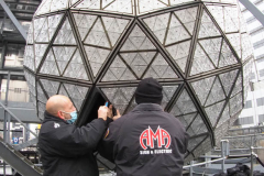 Workers install Waterford Crystal triangles on the Times Square New Year's Eve Ball on December 27, 2021 in New York.
