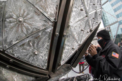 Workers install Waterford Crystal triangles on the Times Square New Year's Eve Ball on December 27, 2021 in New York.