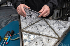 Workers install Waterford Crystal triangles on the Times Square New Year's Eve Ball on December 27, 2021 in New York.
