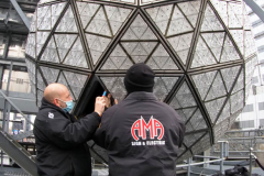 Workers install Waterford Crystal triangles on the Times Square New Year's Eve Ball on December 27, 2021 in New York.