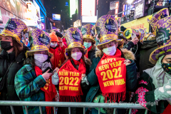 Revelers celebrate the New Year in Times Square 1/1/22.  Although the crowds were smaller, 15,000 instead of 58,000, it appeared to be a very crowded celebration.