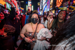 Revelers celebrate the New Year in Times Square 1/1/22.  Although the crowds were smaller, 15,000 instead of 58,000, it appeared to be a very crowded celebration.