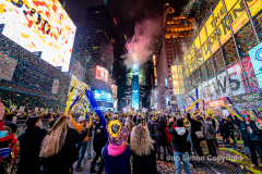 Revelers celebrate the New Year in Times Square 1/1/22.  Although the crowds were smaller, 15,000 instead of 58,000, it appeared to be a very crowded celebration.