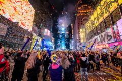 Revelers celebrate the New Year in Times Square 1/1/22.  Although the crowds were smaller, 15,000 instead of 58,000, it appeared to be a very crowded celebration.