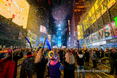 Revelers celebrate the New Year in Times Square 1/1/22.  Although the crowds were smaller, 15,000 instead of 58,000, it appeared to be a very crowded celebration.