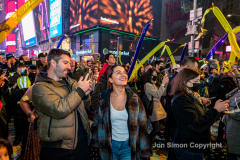 Revelers celebrate the New Year in Times Square 1/1/22.  Although the crowds were smaller, 15,000 instead of 58,000, it appeared to be a very crowded celebration.