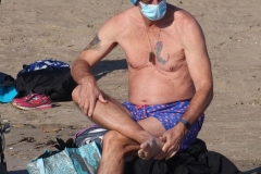 December 13,2020 Coney Island Polar Bear Club enjoys beautiful weather while people stroll the boardwalk and enjoy the sunny weather before the predicted snow storm to hit the East Coast on Wednesday.
