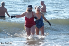 December 13,2020 Coney Island Polar Bear Club enjoys beautiful weather while people stroll the boardwalk and enjoy the sunny weather before the predicted snow storm to hit the East Coast on Wednesday.