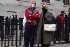 December 13,2020  Wall Street in front of the New York Stock Exchange residents and tourists visit the Fearless Girl statue and take photographs by the Stock exchange Christmas tree.