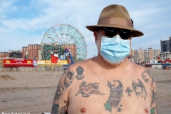 December 13,2020 Coney Island Polar Bear Club enjoys beautiful weather while people stroll the boardwalk and enjoy the sunny weather before the predicted snow storm to hit the East Coast on Wednesday.